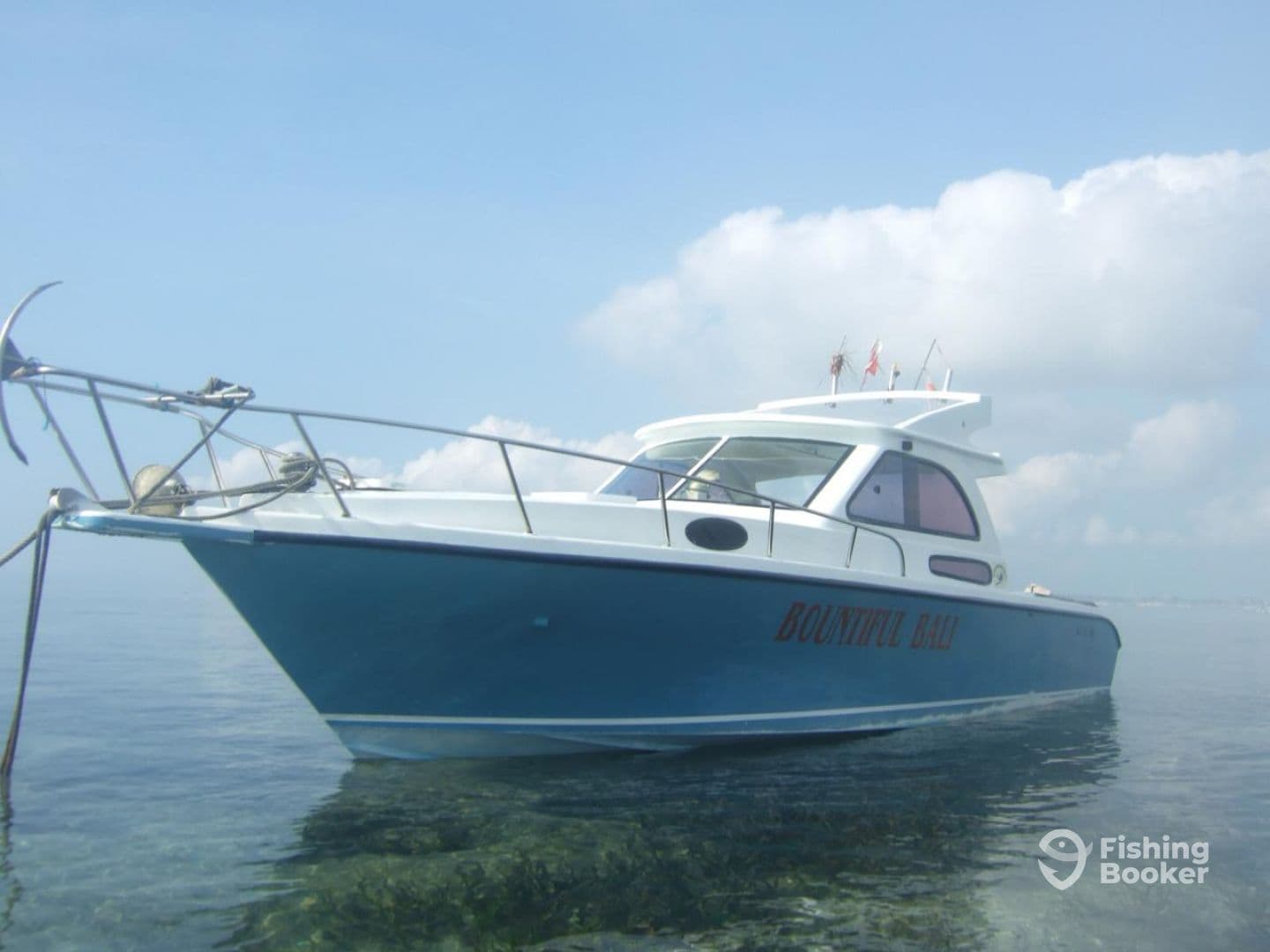 Guest fighting a fish on a Bali fishing charter from Serangan